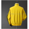 Mens Jamaica Trench Coat Reversible yellow and Black Windbreaker 2025 Mens Jamaica Trench Coat Reversible Yellow and Black Windbreaker 2025 yellow side rear view with Wales Bonner collar print