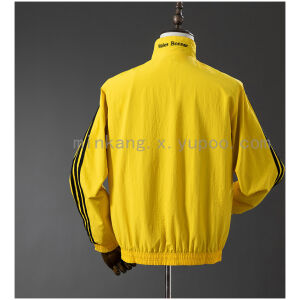 Mens Jamaica Trench Coat Reversible Yellow and Black Windbreaker 2025 yellow side rear view with Wales Bonner collar print