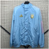 Mens Argentina Blue Windbreaker 2025 sky blue hooded jacket front view on rack with storm placket and gold AFA crest