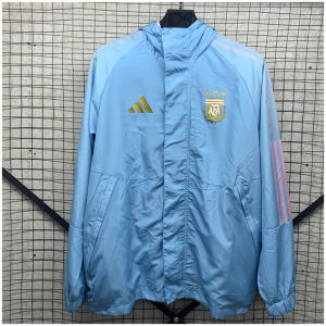 Mens Argentina Light Blue Windbreaker 2025 Mens Argentina Blue Windbreaker 2025 sky blue hooded jacket front view on rack with storm placket and gold AFA crest