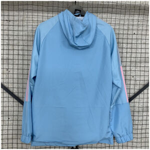 Mens Argentina Blue Windbreaker 2025 sky blue hooded jacket rear view on rack showing attached hood and salmon pink sleeve stripes