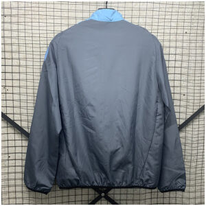 Mens Argentina Blue Windbreaker 2025 slate grey jacket rear view on wire rack showing clean back and sky-blue side contours