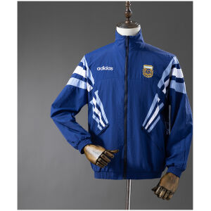 Mens Argentina Royal Blue Windbreaker 2025 Mens Argentina Blue Windbreaker 2025 royal blue jacket front view on mannequin with white and sky-blue chevron stripes and AFA crest