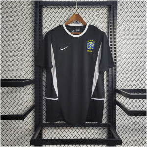 Mens World Cup Brazil Black Retro Goalkeeper Jersey 2002 Mens World Cup Brazil Black Retro Goalkeeper Jersey 2002 black shirt front view on hanger with white piping and CBF crest