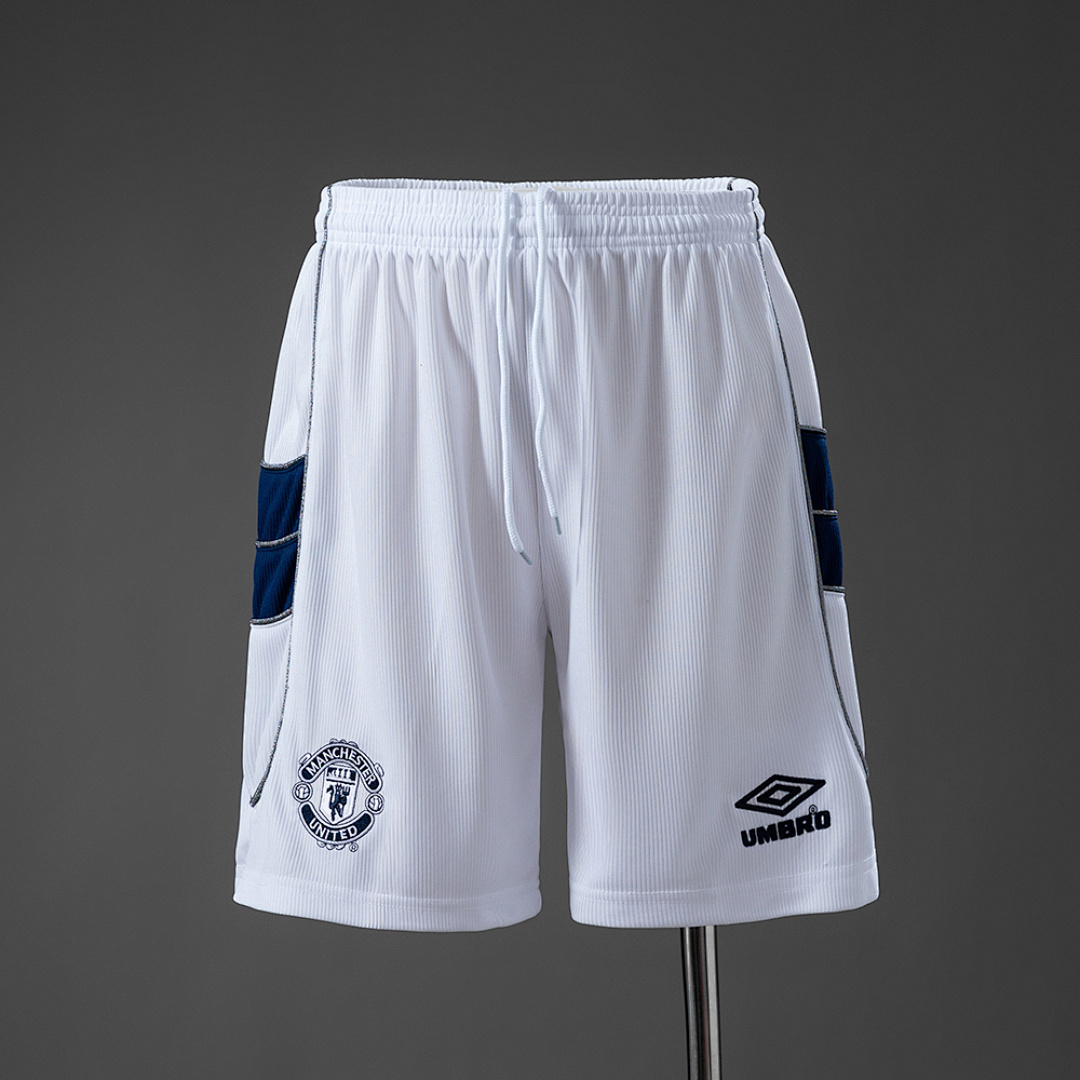 Mens Manchester United Retro Away Shorts 1999/00 Mens Manchester United Retro Away Shorts 1999/00 white shorts front view with navy side panels and embroidered crest