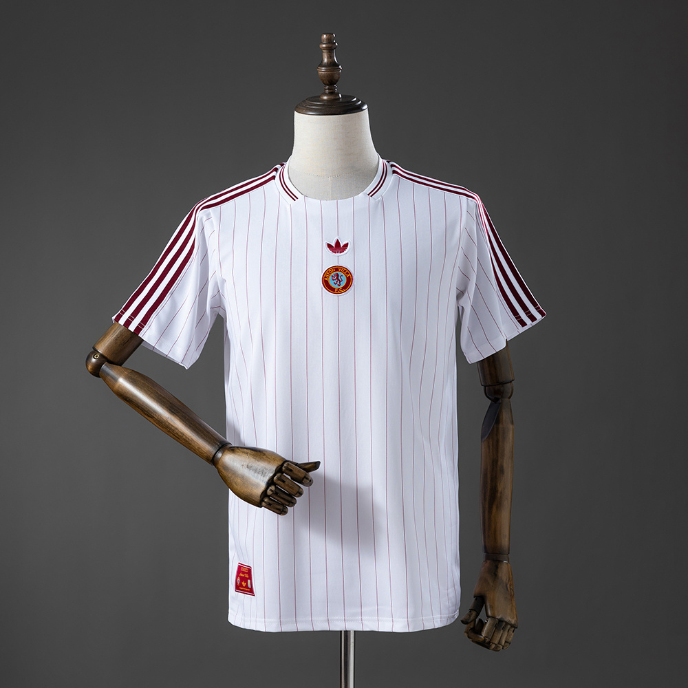 Mens Aston Villa FC Terrace Icons Jersey 2026 Mens Aston Villa FC Terrace Icons Jersey 2026 front view in white with claret pinstripes, Trefoil, and centered crest