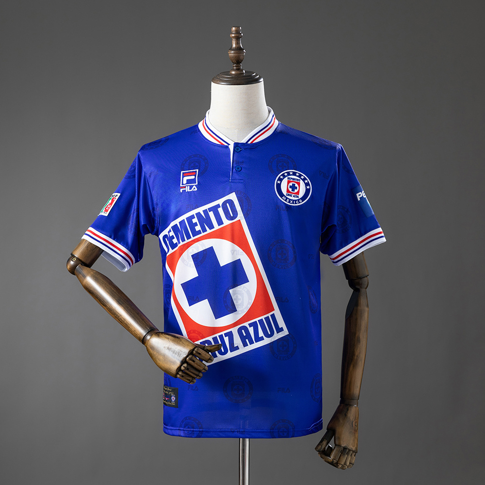Mens Cruz Azul Retro Home Jersey 1998 Mens Cruz Azul Retro Home Jersey 1998 front view in royal blue with white henley collar and Cemento Cruz Azul sponsor