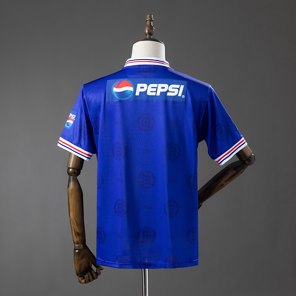 Mens Cruz Azul Retro Home Jersey 1998 Mens Cruz Azul Retro Home Jersey 1998 rear view in blue showing jacquard watermark pattern and upper back Pepsi panel