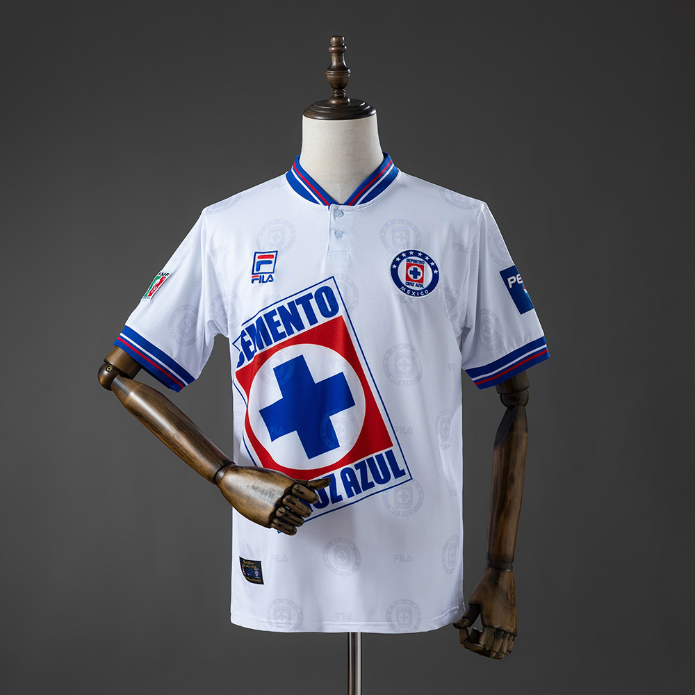 Mens Cruz Azul Retro Away Jersey 1998 Mens Cruz Azul Retro Away Jersey 1998 front view in white showing blue-red collar and angled Cemento Cruz Azul sponsor