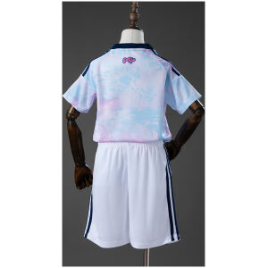 Kids Costa Rica Away Kit 2026 rear view showing pastel patterned jersey with pink Pura Vida script and white shorts