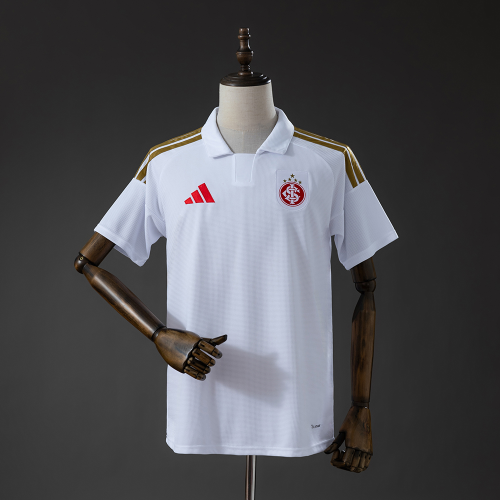 Mens Internacional Away Jersey 2026/27 Front view of Mens Internacional Away Jersey 2026/27 in white with gold stripes and red crest