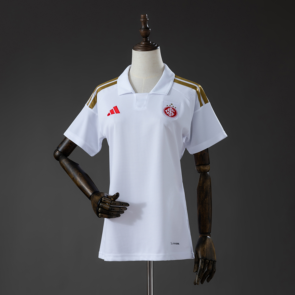 Womens Internacional Away Jersey 2026/27 Front view of Womens Internacional Away Jersey 2026/27 showing tailored cut and gold stripes