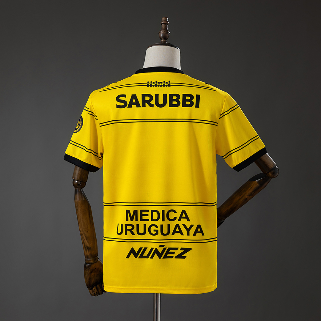 Mens Club Atlético Peñarol Away Jersey 2026/27 Rear view of Mens Club Atlético Peñarol Away Jersey 2026/27 showing locomotive emblem and sponsors