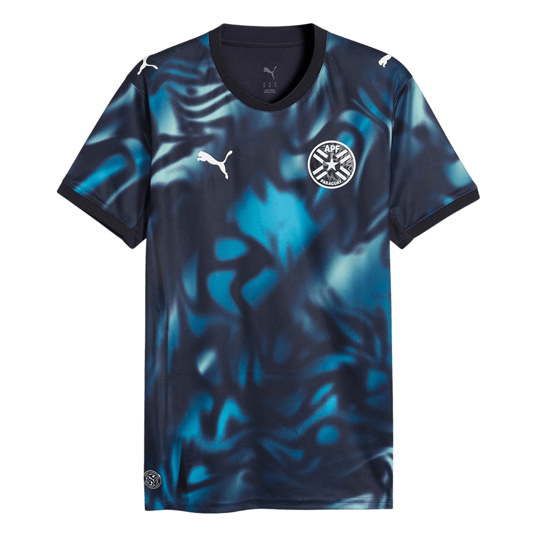 Mens Paraguay Away Jersey 2026 Front view of Mens Paraguay Away Jersey 2026 in dark navy with cyan smoke graphic and APF crest