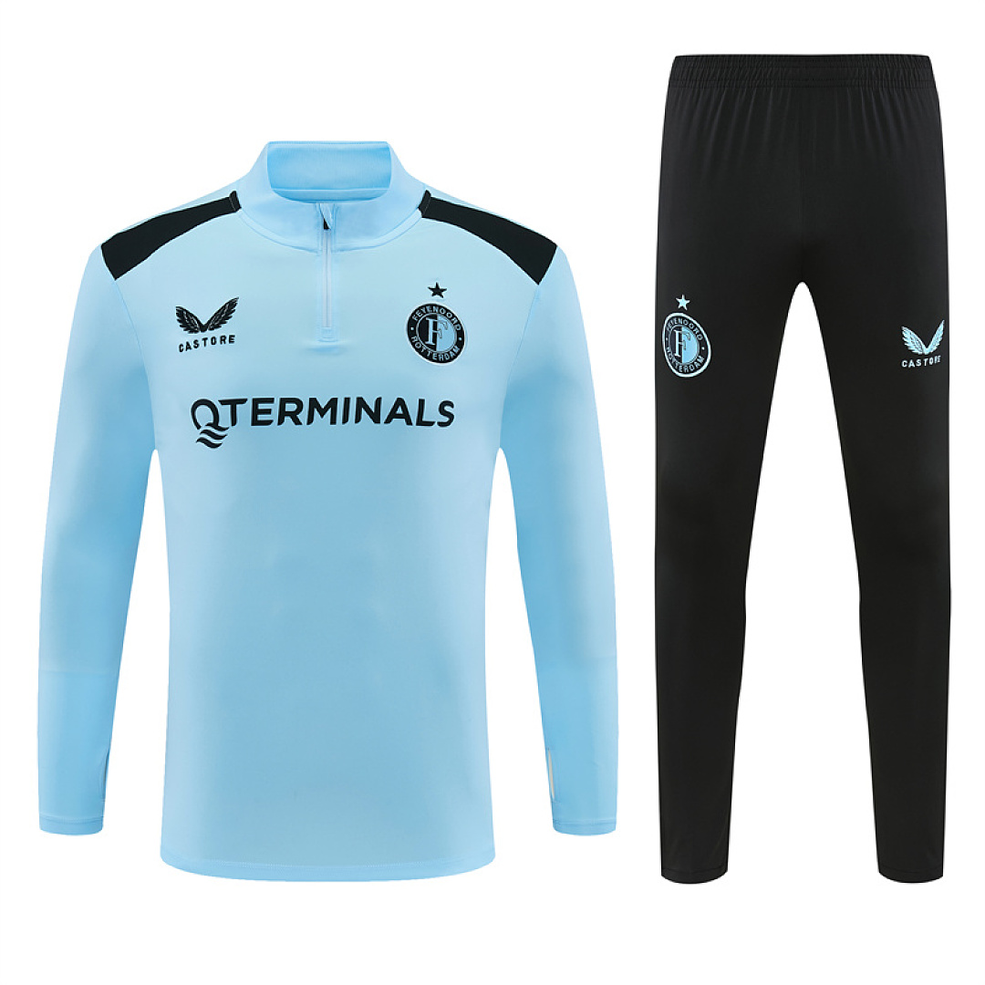 Mens Feyenoord Half-zip Light Blue Training Kit Suit 2026/27 Mens Feyenoord Half-zip Light Blue Training Kit Suit 2026/27 light blue top and black pants front view