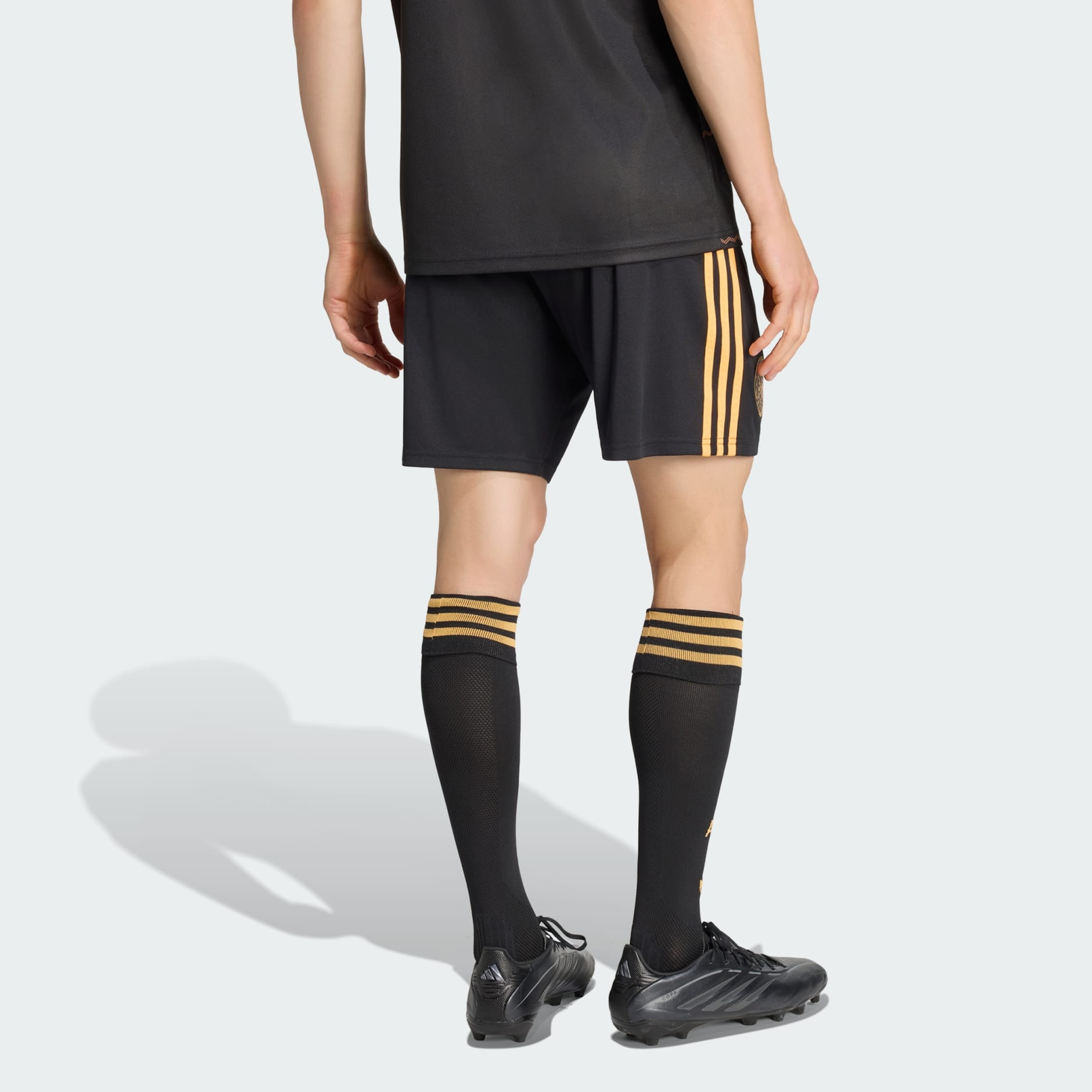 Mens Ajax Away Shorts 2026/27 Mens Ajax Away Shorts 2026/27 black shorts rear view showing ochre three-stripes and elastic waist