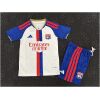 Front view of Kids Olympique Lyonnais Home Kit 2026/27 with blue shorts