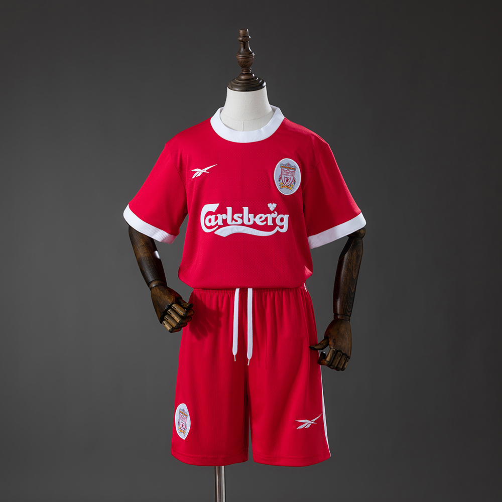 Kids Liverpool Retro Home Kit 1995/96 Kids Liverpool Retro Home Kit 1995/96 front view showing red jersey and shorts with Carlsberg sponsor