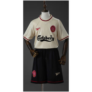 Kids Liverpool Retro Away Kit 1996/97 front view with ecru jersey, black shorts, and Carlsberg sponsor
