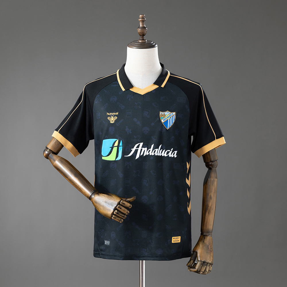 Mens Malaga Style Retro Jersey 2025/26 Front view of the Mens Malaga Style Retro Jersey 2025/26 in black and gold featuring Andalucia sponsor and club crest
