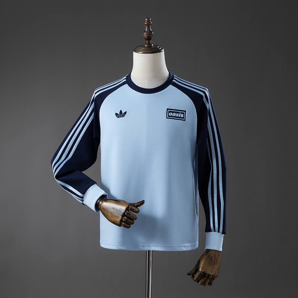 Mens Oasis Tour Three-Striped Sky Blue Long Sleeve T-Shirt Mens Oasis Tour Three-Striped Sky Blue Long Sleeve T-Shirt front view with navy sleeves