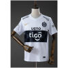 Front view of the Mens Olimpia 2026 Home Jersey 2026/27 in white with black horizontal chest band and gold swoosh