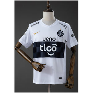 Front view of the Mens Olimpia 2026 Home Jersey 2026/27 in white with black horizontal chest band and gold swoosh