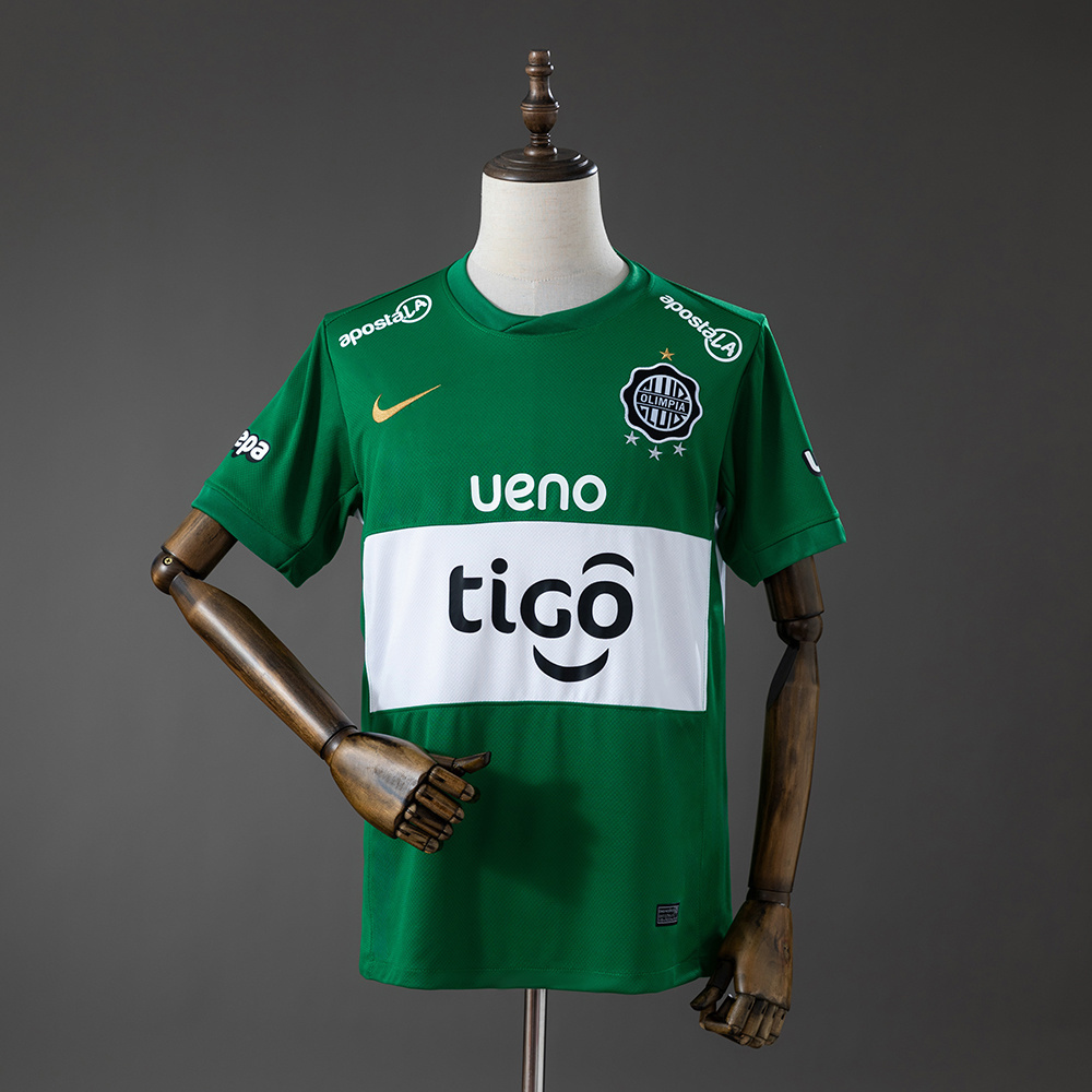 Mens Olimpia Third Jersey 2026/27 Mens Olimpia Third Jersey 2026/27 front view in emerald green with white horizontal chest band