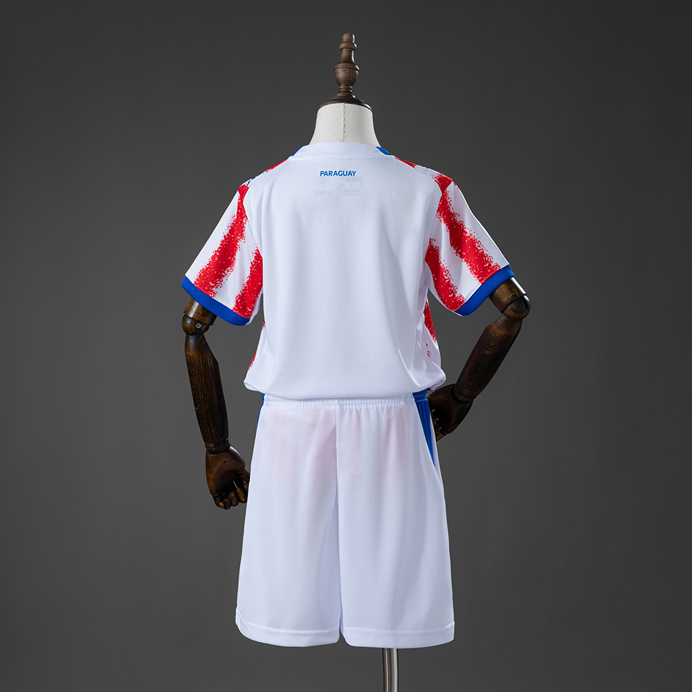 Kids Paraguay Home Kit 2026 Kids Paraguay Home Kit 2026 rear view of shirt and shorts
