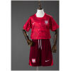 Kids Poland Away Kit 2026 front view featuring crimson lightning-pattern jersey and maroon shorts