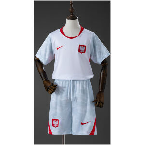 Kids Poland Home Kit 2026 front view showing white jersey with red accents and matching patterned shorts