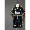 Kids Real Madrid Retro Away Kit 1999/01 front view showing black jersey with gold details and matching shorts
