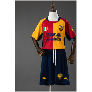 Kids Roma Champion Edition Retro Kit 2000/01 front view showing half-and-half red and gold jersey with navy shorts