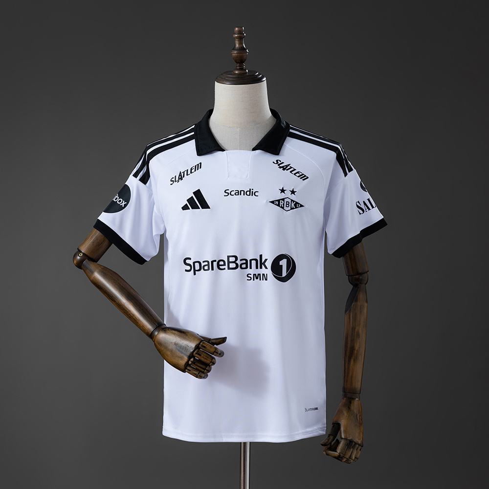 Mens Rosenborg Home Jersey 2026/27 Front view of the Mens Rosenborg Home Jersey 2026/27 in white with black polo collar and two-star crest