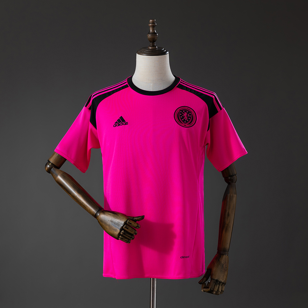Mens Scotland The Tartan Army Retro Away Jersey 2016 Mens Scotland The Tartan Army Retro Away Jersey 2016 shock pink shirt front view with black collar and crest