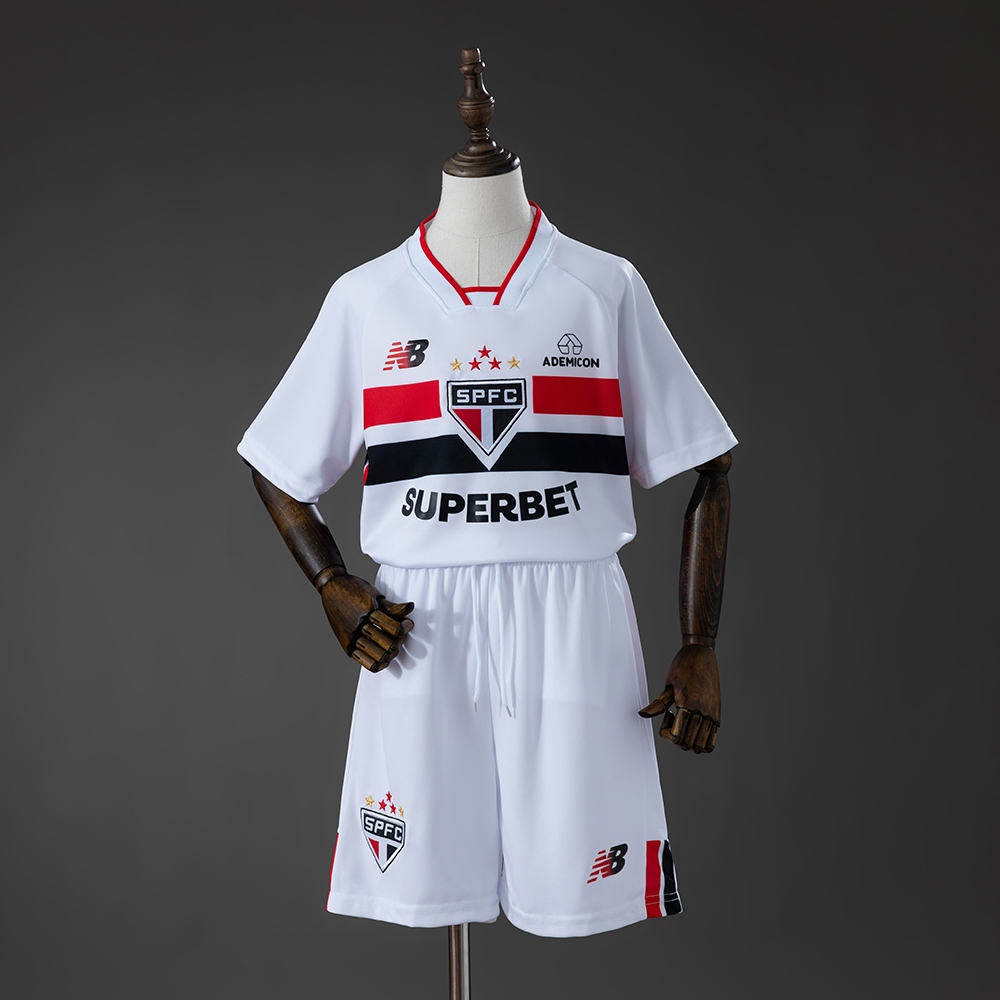 Kids Sao Paulo Home Kit 2026/27 Kids Sao Paulo Home Kit 2026/27 front view showing white jersey with red and black chest stripes and shorts
