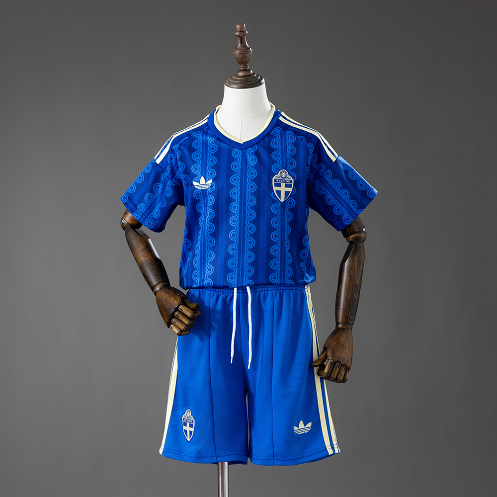 Kids Sweden Away Kit 2026 Kids Sweden Away Kit 2026 front view in royal blue with wavy patterns and matching shorts