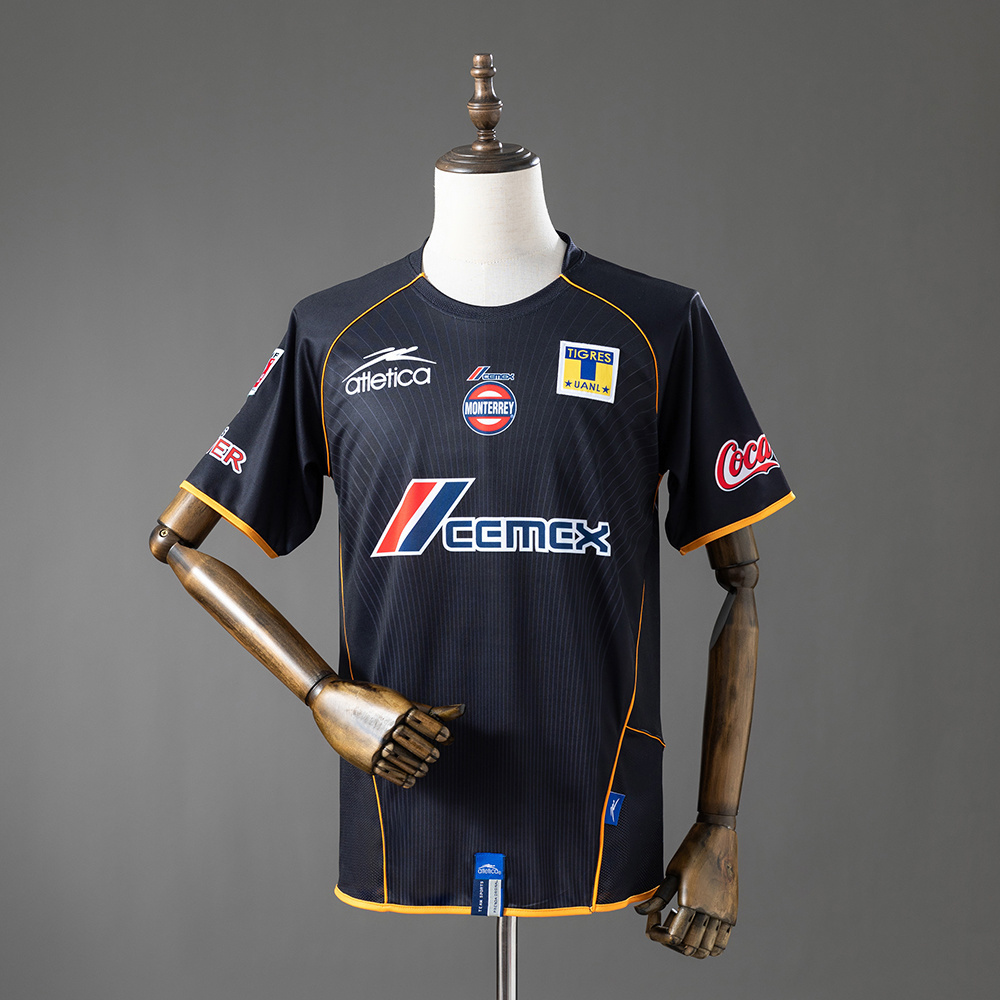 Mens Tigres UANL Retro Third Jersey 2005/06 Mens Tigres UANL Retro Third Jersey 2005/06 front view in black with yellow piping