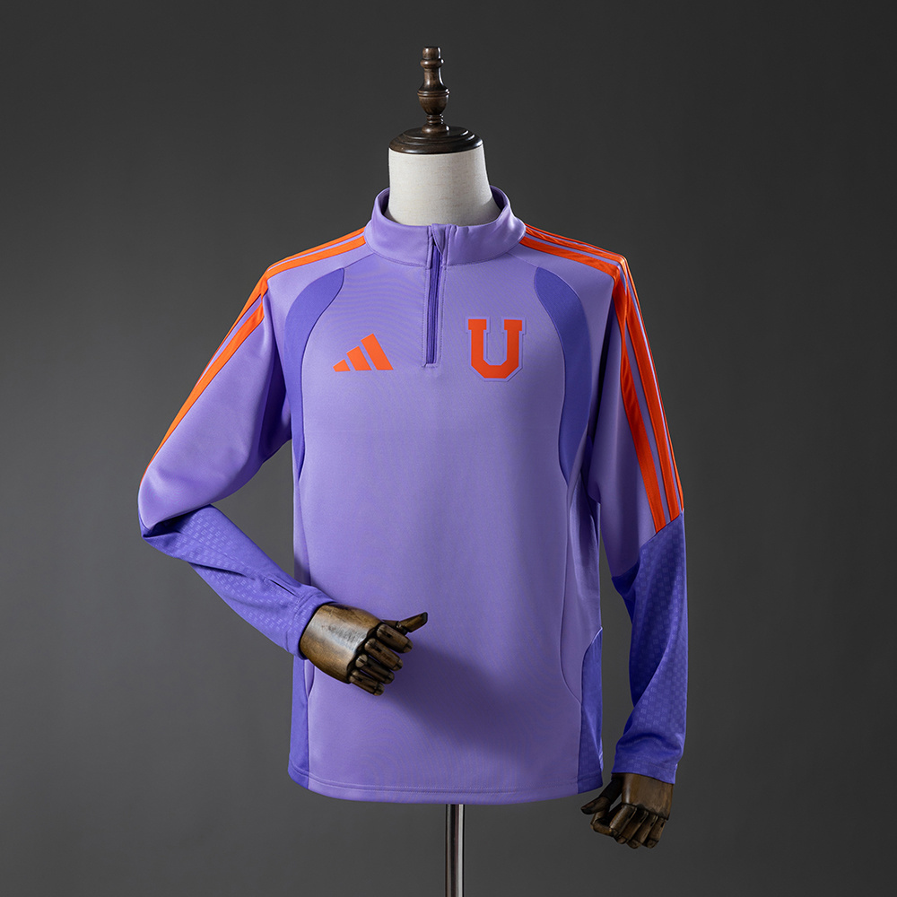 Mens Universidad Shirt Long Sleeve Training Kit Jersey 2026/27 Light purple long-sleeve quarter-zip training jersey with orange stripes front view