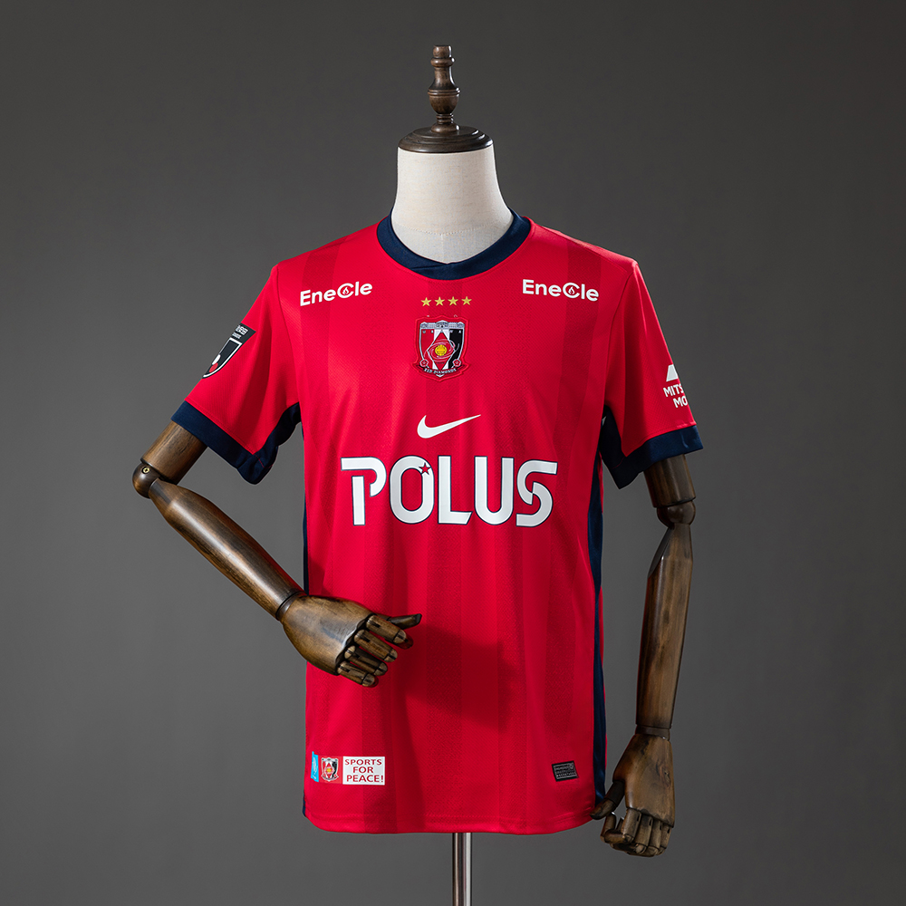 Mens 浦和レッズ Urawa Red Diamonds Home Jersey 2026/27 Mens 浦和レッズ Urawa Red Diamonds Home Jersey 2026/27 front view with centered crest, POLUS sponsor, and navy trim