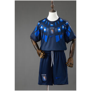 Kids Uruguay Away Kit 2026 front view of navy jersey and shorts with sunbeam graphic and AUF crest