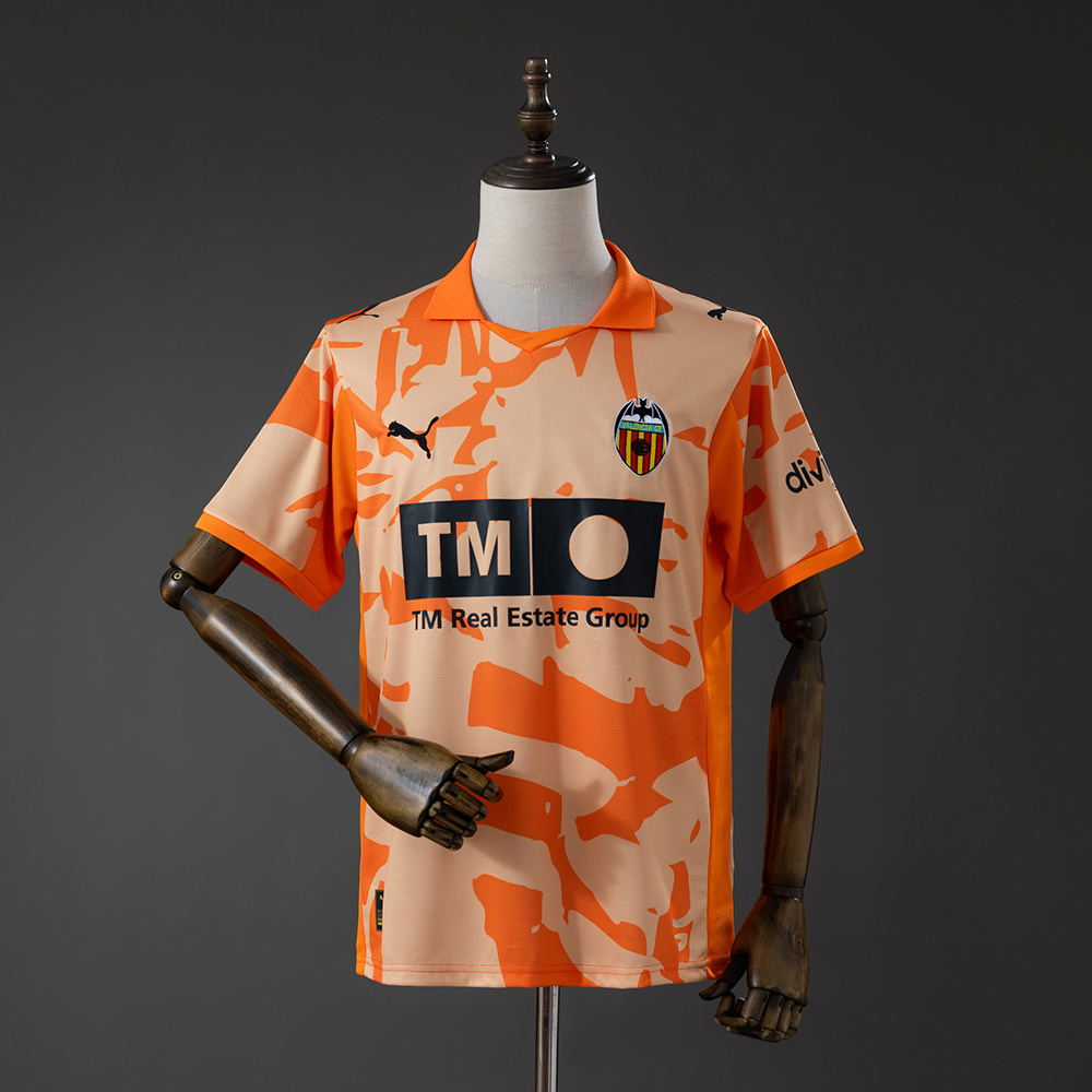 Mens Valencia Style Retro Jersey 2025/26 Mens Valencia Style Retro Jersey 2025/26 orange camo shirt front view with polo collar and Valencia crest