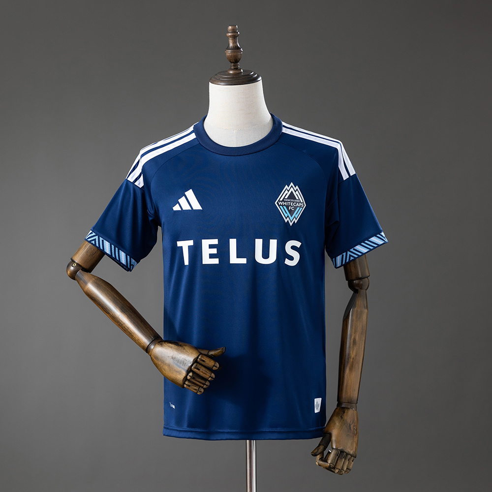 Mens Vancouver Canucks Away Jersey 2026/27 Mens Vancouver Canucks Away Jersey 2026/27 front view in navy blue with Whitecaps crest and Telus sponsor