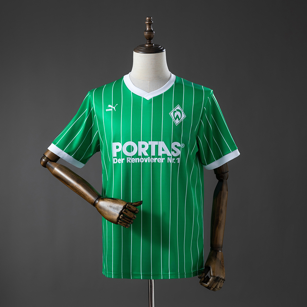 Mens Werder Bremen Retro Home Jersey 1988 Front view of the Mens Werder Bremen Retro Home Jersey 1988 in green with white pinstripes and PORTAS sponsor