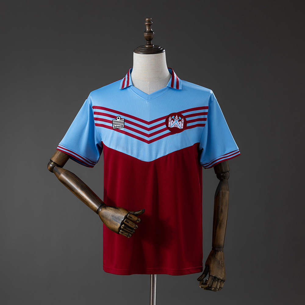 Mens West Ham United Retro Home Jersey 1976/80 Front view of the Mens West Ham United Retro Home Jersey 1976/80 featuring claret and sky blue chevron design