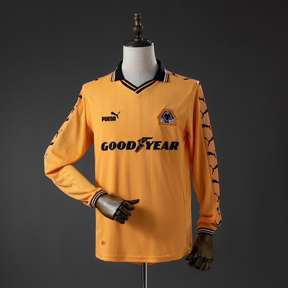 Mens Wolverhampton Wanderers Wolves Retro Long Sleeve Home Jersey 1998/99 Front view of the Mens Wolverhampton Wanderers Wolves Retro Long Sleeve Home Jersey 1998/99 in amber gold with Goodyear sponsor
