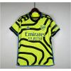 Mens Arsenal Away Jersey 2023/24 on hanger showing shock yellow body with black topographic map lines and blue trim