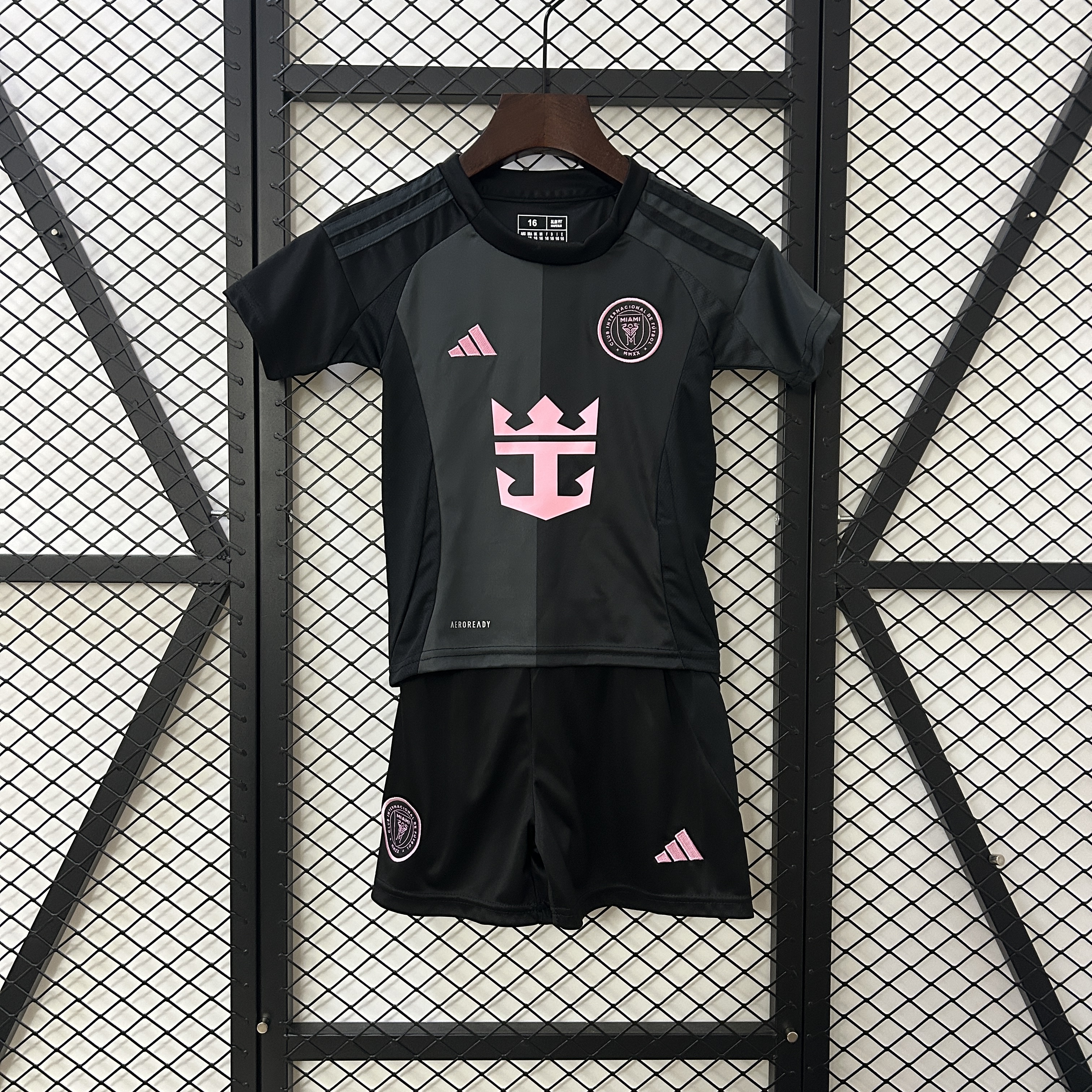 Kids Miami Away Kit 2025/26 Kids Miami Away Kit 2025/26 front view showing two-tone shirt and shorts