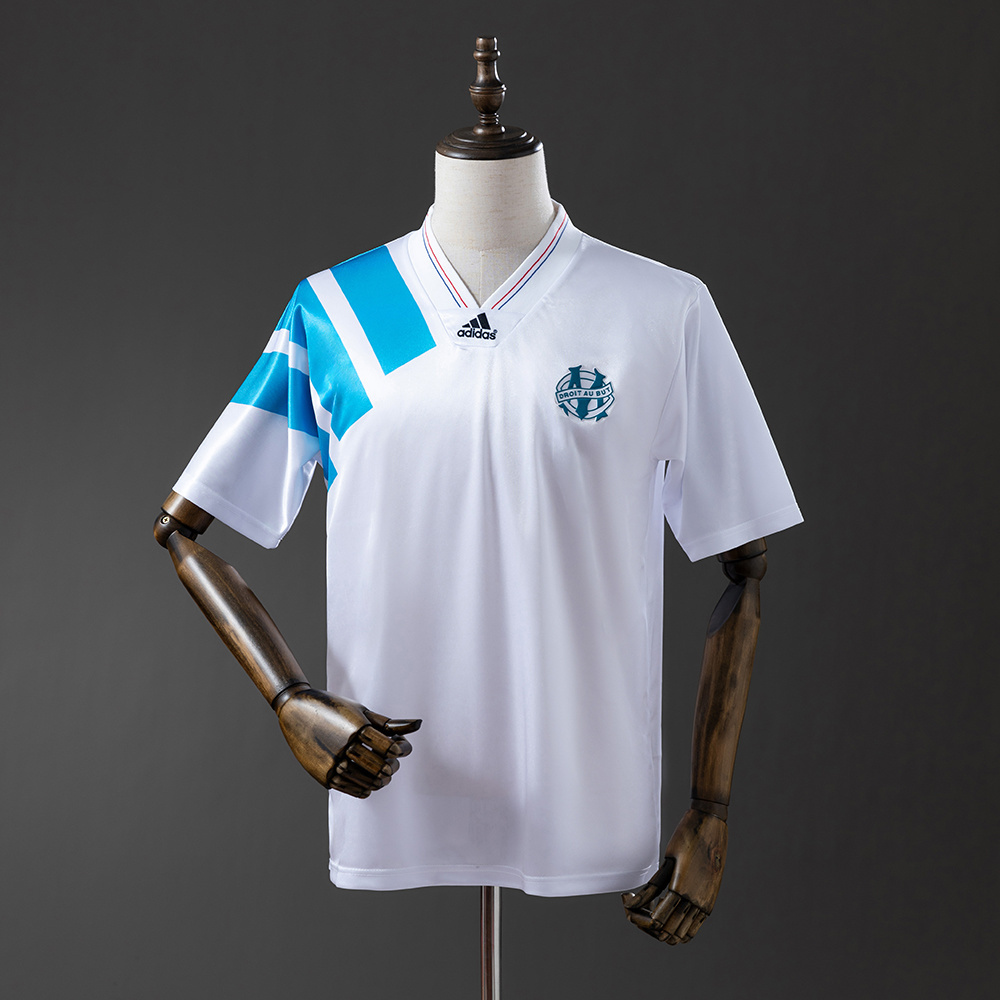 Mens Marseille Retro Home Jersey 1992/93 Mens Marseille Retro Home Jersey 1992/93 on mannequin showing white body and diagonal sky blue shoulder stripes