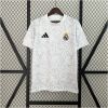 Mens Real Madrid 2024/25 white pre-match top with grey star graphic front view
